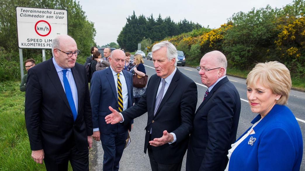 EU Chief Brexit Negotiator Michel Barnier (centre) talking with Phil Hogan European Commissioner for Agriculture and Rural Development (left), chief executive of Co-operation Ireland Peter Sheridan (2nd left), Irish Minster for Forgein Affairs Charlie Flanagan (2nd right), and Heather Humphreys TD at the border road on the N53 road between Co. Louth and the N3 road in Co. Armagh Northern Ireland..