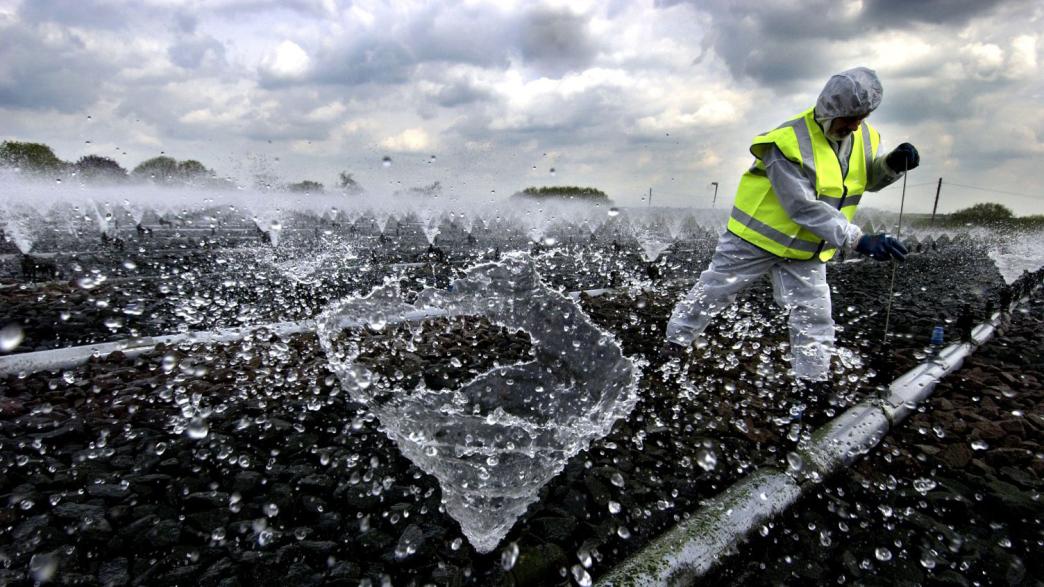 A worker at a water regulation plant
